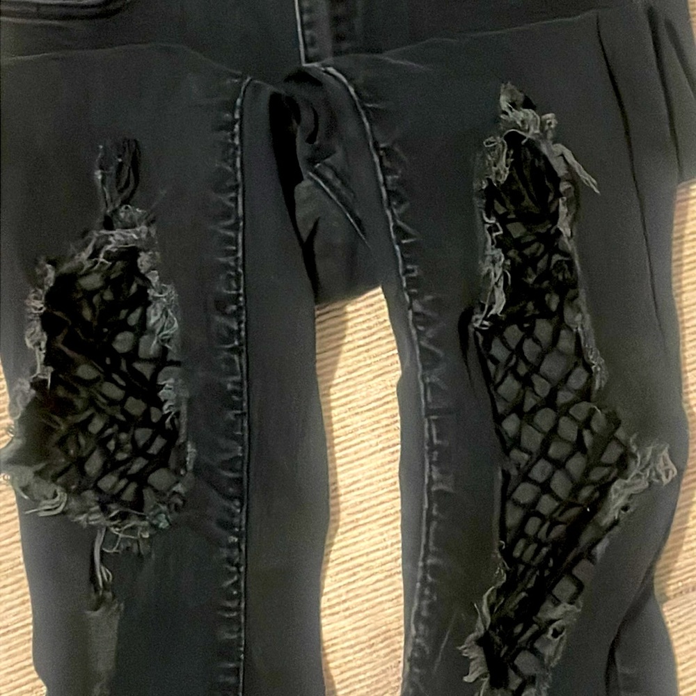V.I.P dark blue ripped fishnet jeans.